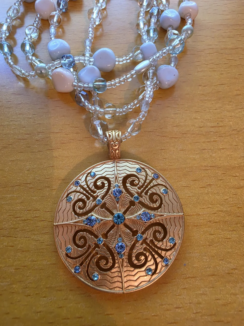 Avon By Nina Ricci Gold-Tone Pendant Necklace with White, Blue and Clear Accents